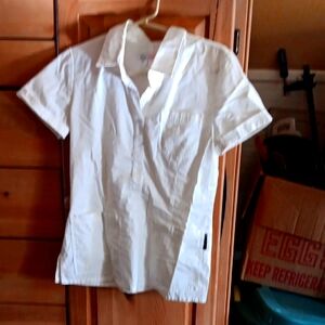 White nurses scrub shirt. Alot of pockets, very convienent & professional .